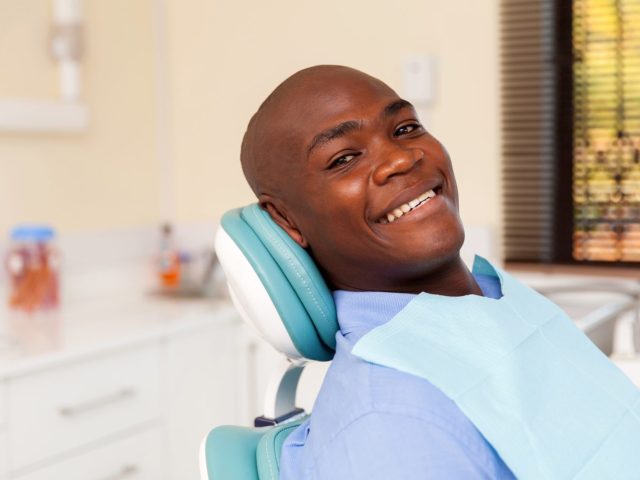 https://archdental.net/wp-content/uploads/2025/09/bigstock-african-man-visiting-dentist-f-94140173-640x480.jpg